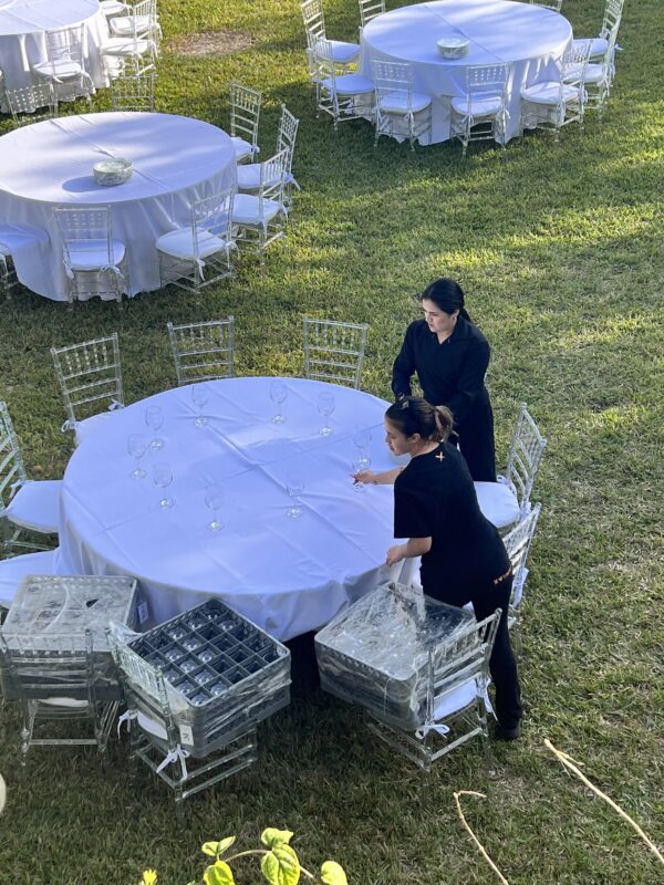 ladies decorating dining tables for event